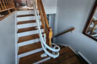 View of the curved rail going up the stairs